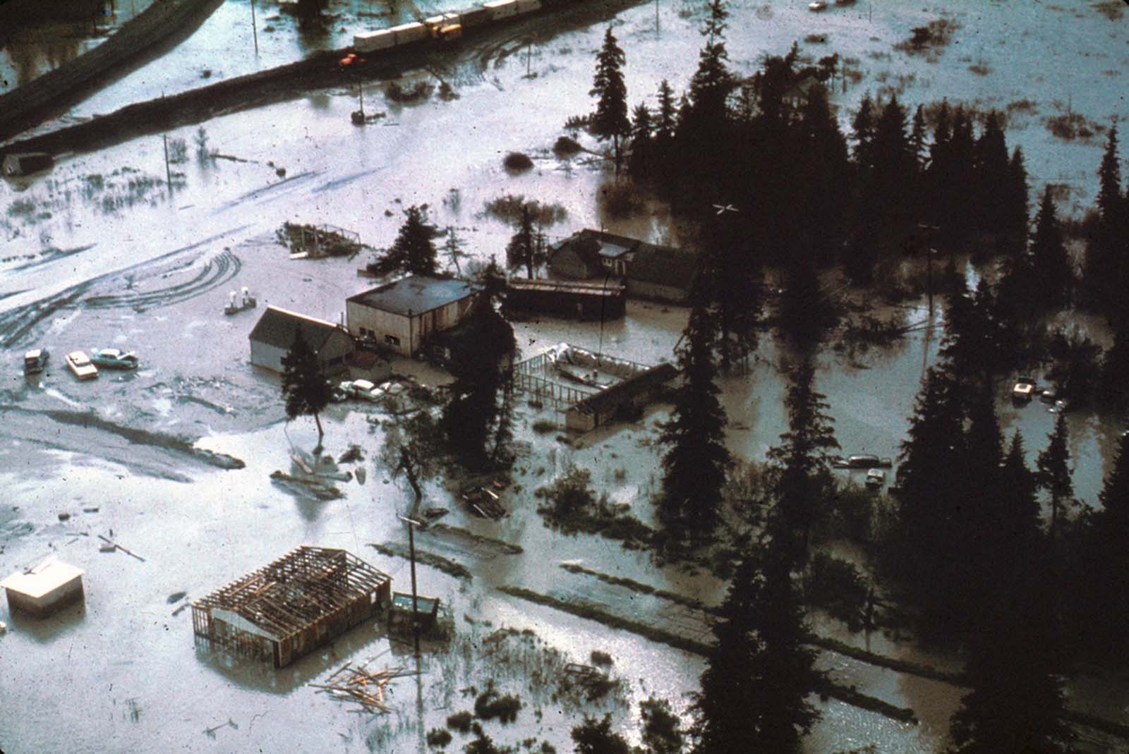 The village of Portage, at the head of Turnagain Arm, flooded at high tide as a result of 6 feet of tectonic subsidence during the earthquake.