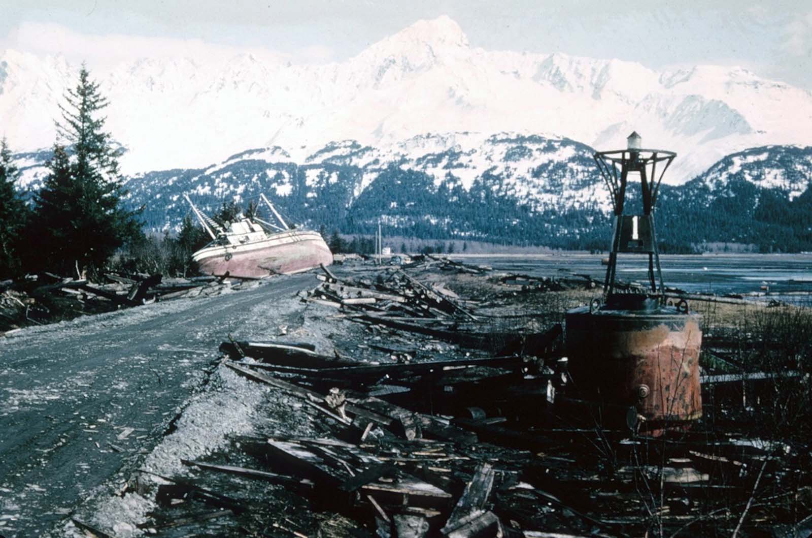 A fishing boat and buoy, washed ashore by tsunami waves in Seward, Alaska.