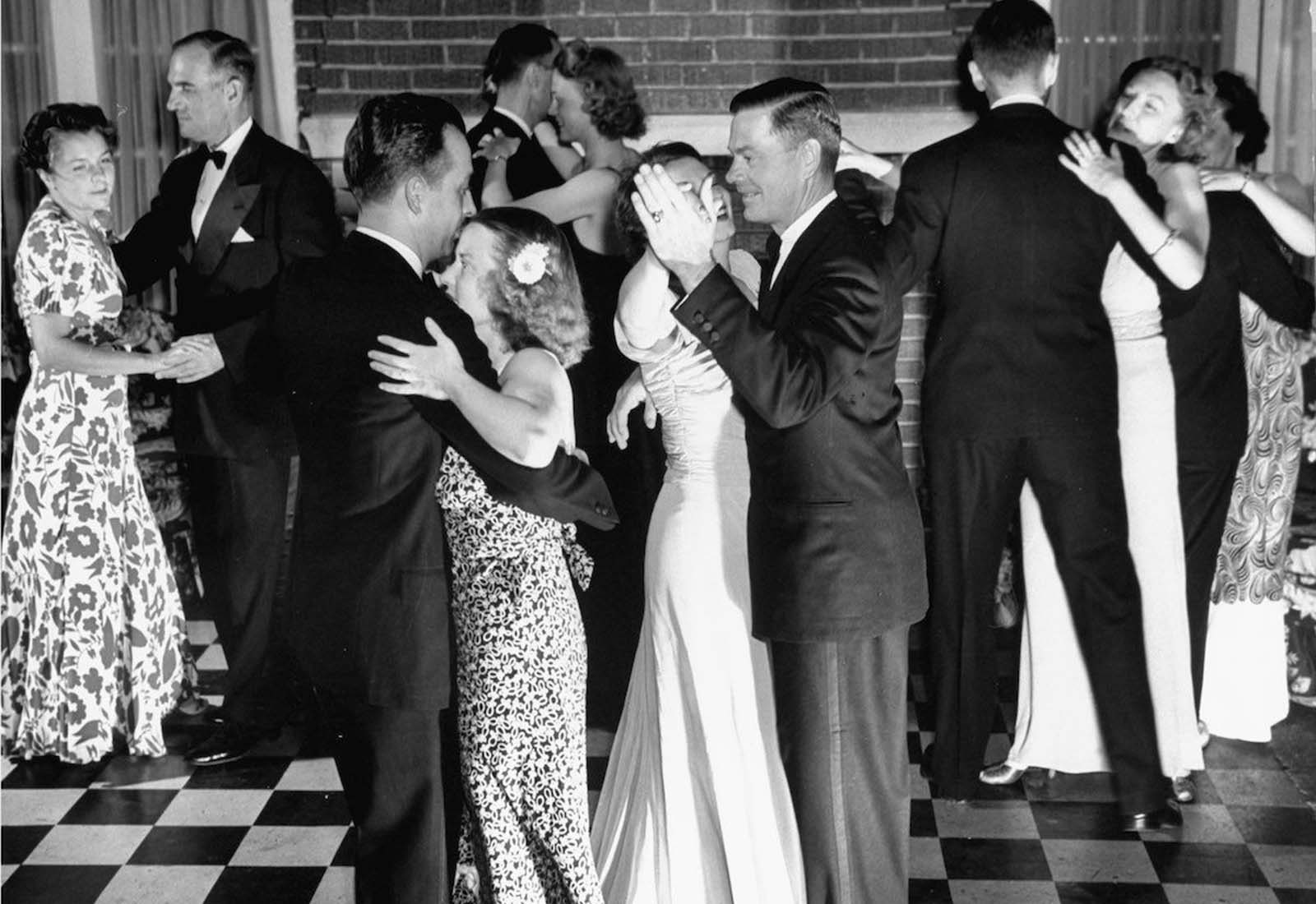 Jane dancing with her husband Gilbert (third from left) amidst other couples at their country club's formal dance.