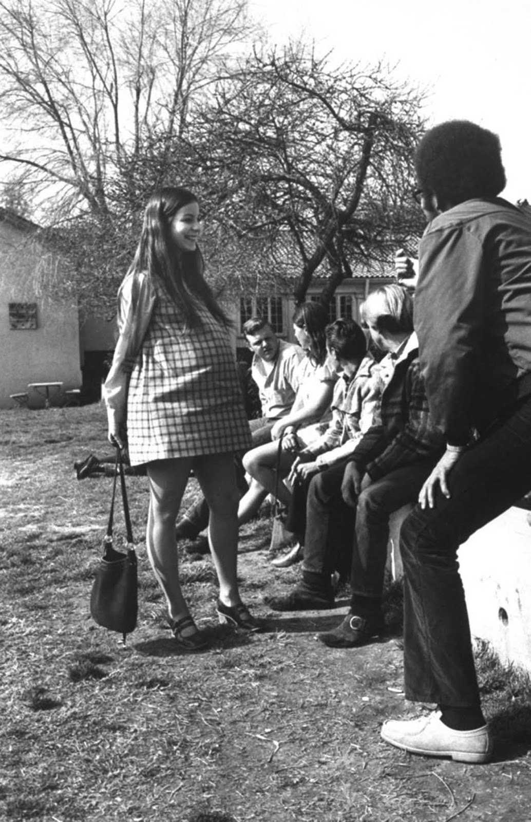 Judy Fay chatted with a group of students outside class. With pregnant girls at Citrus, the boys cleaned up their language and courteously held open doors and even pushed strollers.
