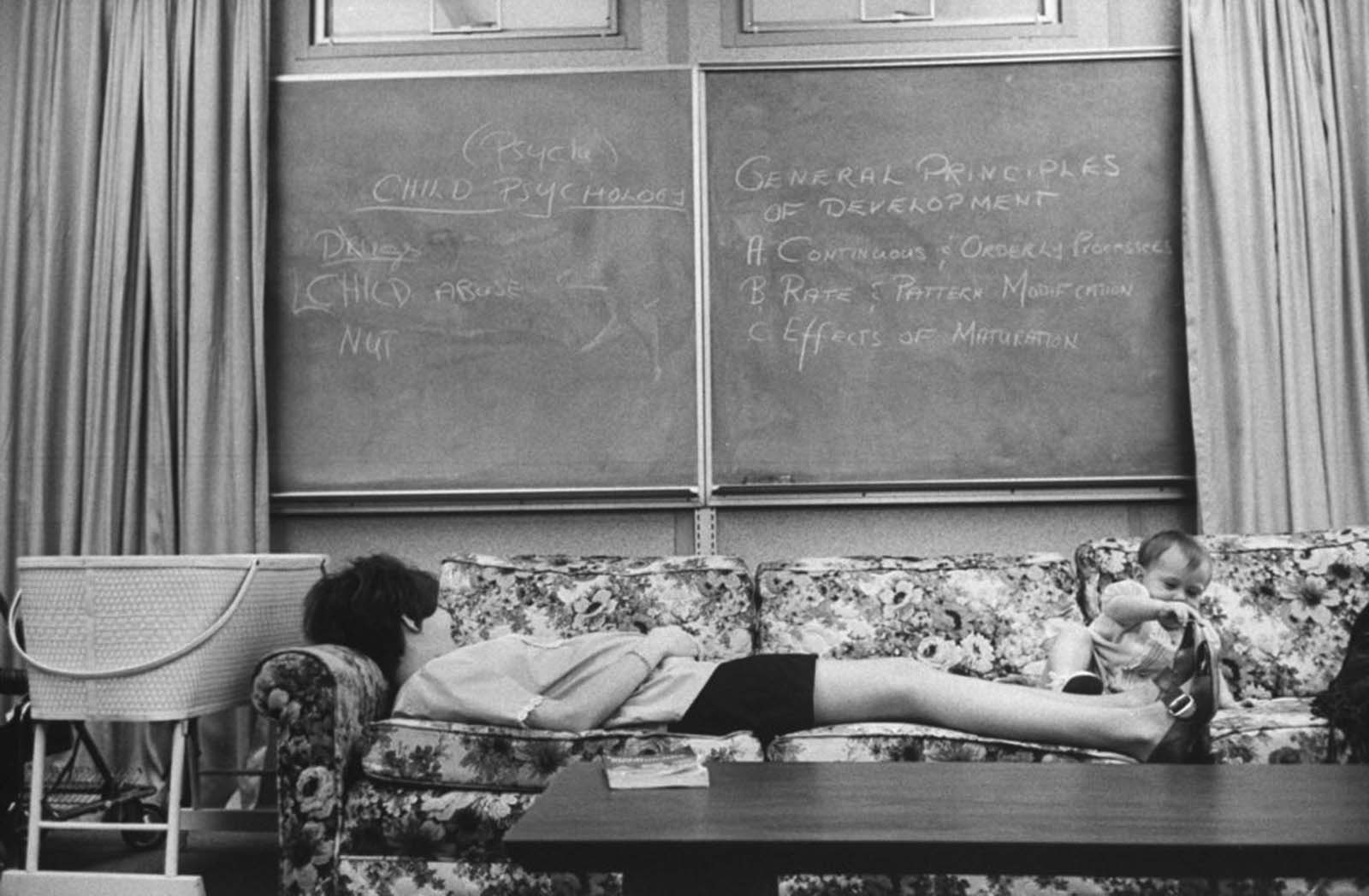 Expectant mothers were allowed to take naps in homemakeing class. Here Lori Cardin, 17 and six months pregnant, tried to catch 40 winks despite playful attention from young Shawn Conger.