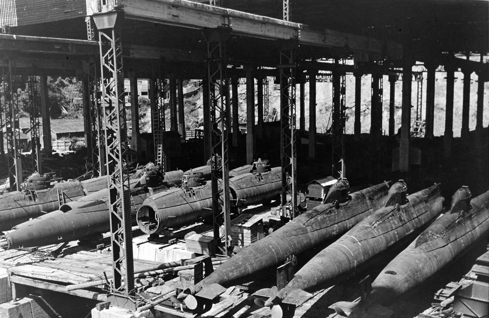 In an assembly shed at the Mitsubishi shipyard, Nagasaki. This shop contained approximately fifteen nearly complete boats, and assemblies for many more. 