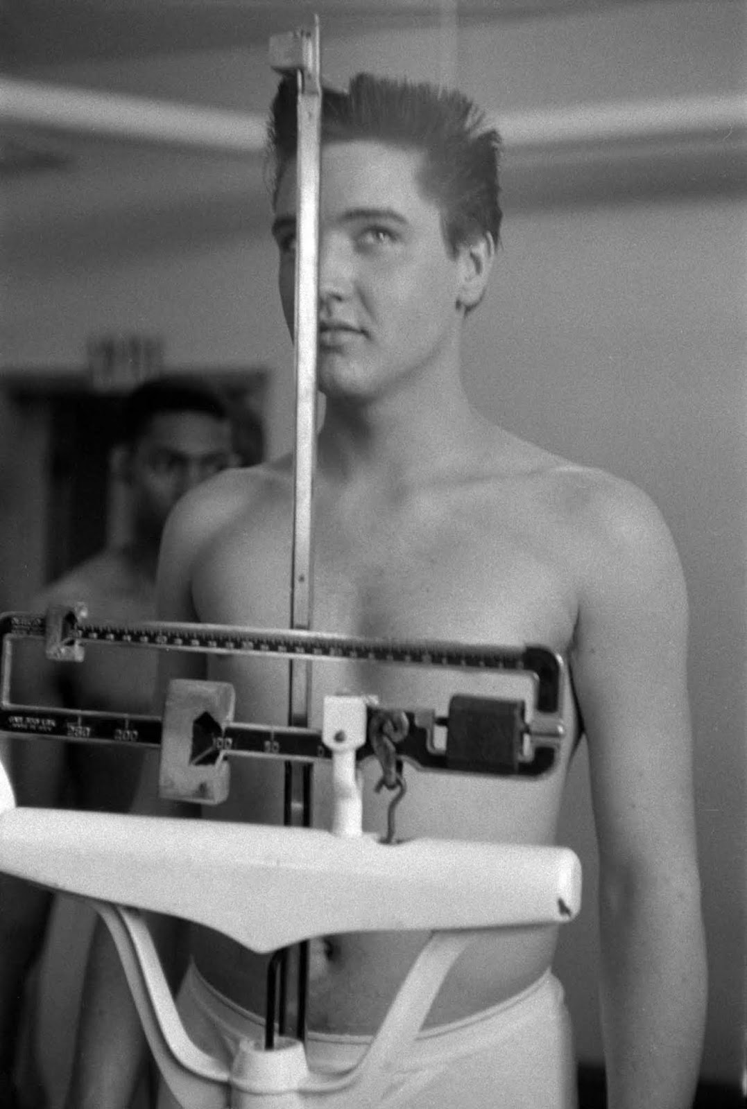 Elvis weighing in at Fort Chaffee, Arkansas.