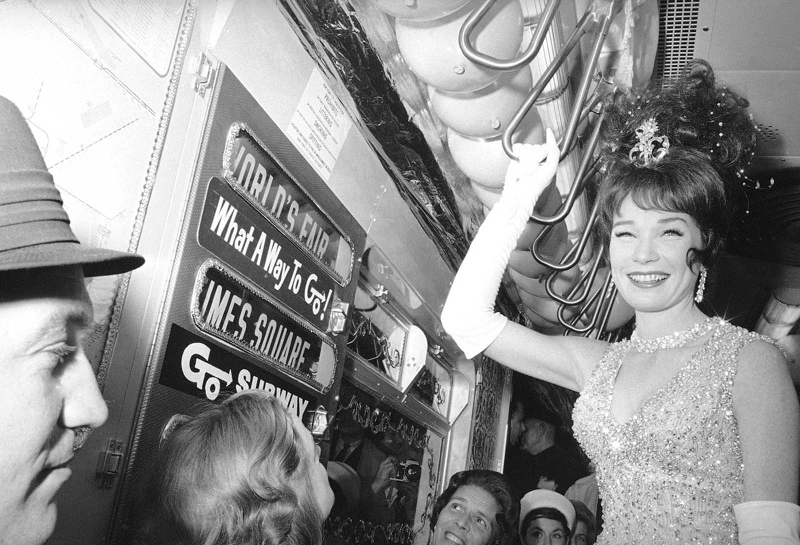 Actress Shirley MacLaine rides the New York subway on her way to the World's Fair for the premiere of her film 