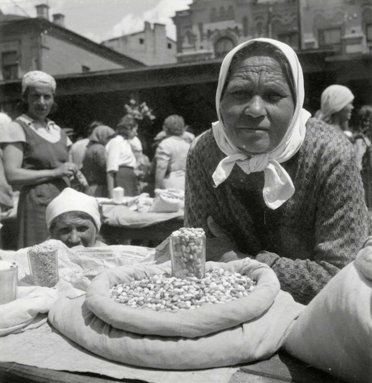 Peasant Women on a market selling beans.