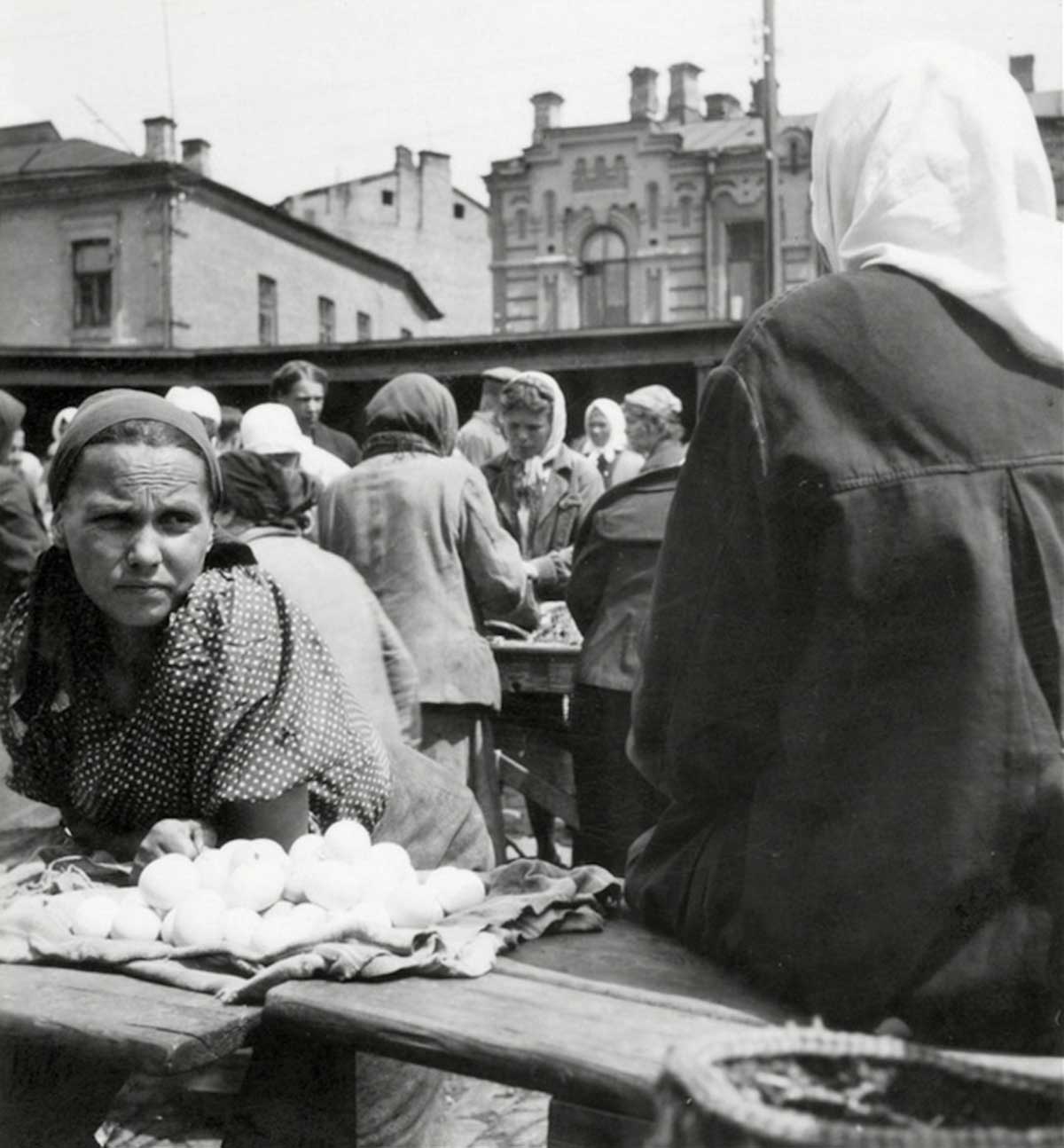 Farmer selling eggs on a market near Odessa. 1943.
