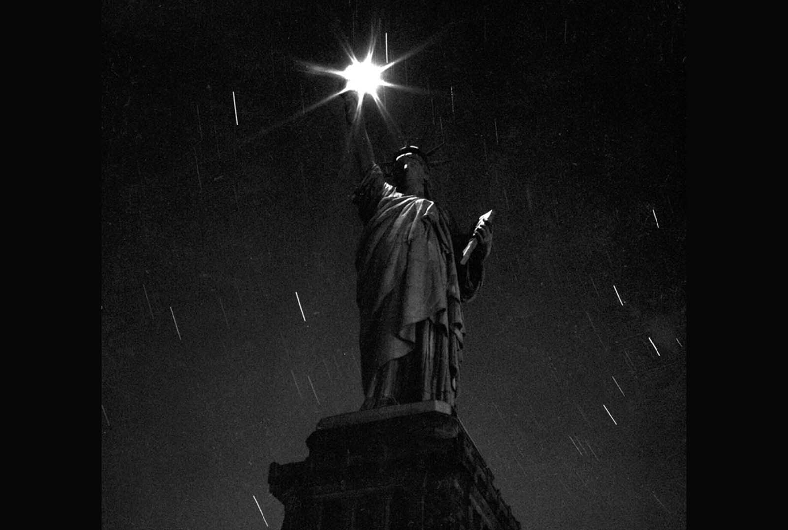 A view of the statue taken at night, during a blackout designed to help conserve energy during World War II, in March of 1942.