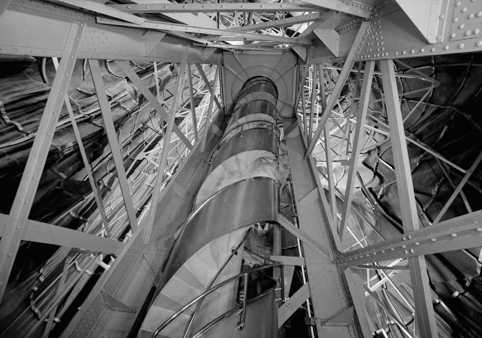 A view looking up a spiral staircase in the statue's interior.