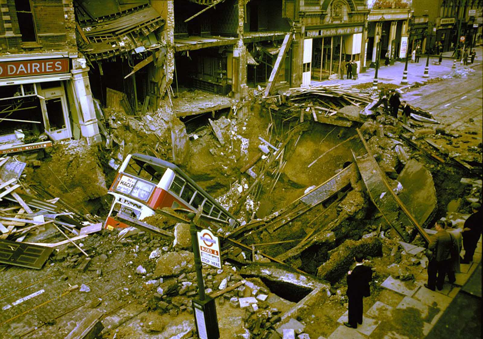 A bus in the bomb crater caused by a German air raid on Balham in South London.