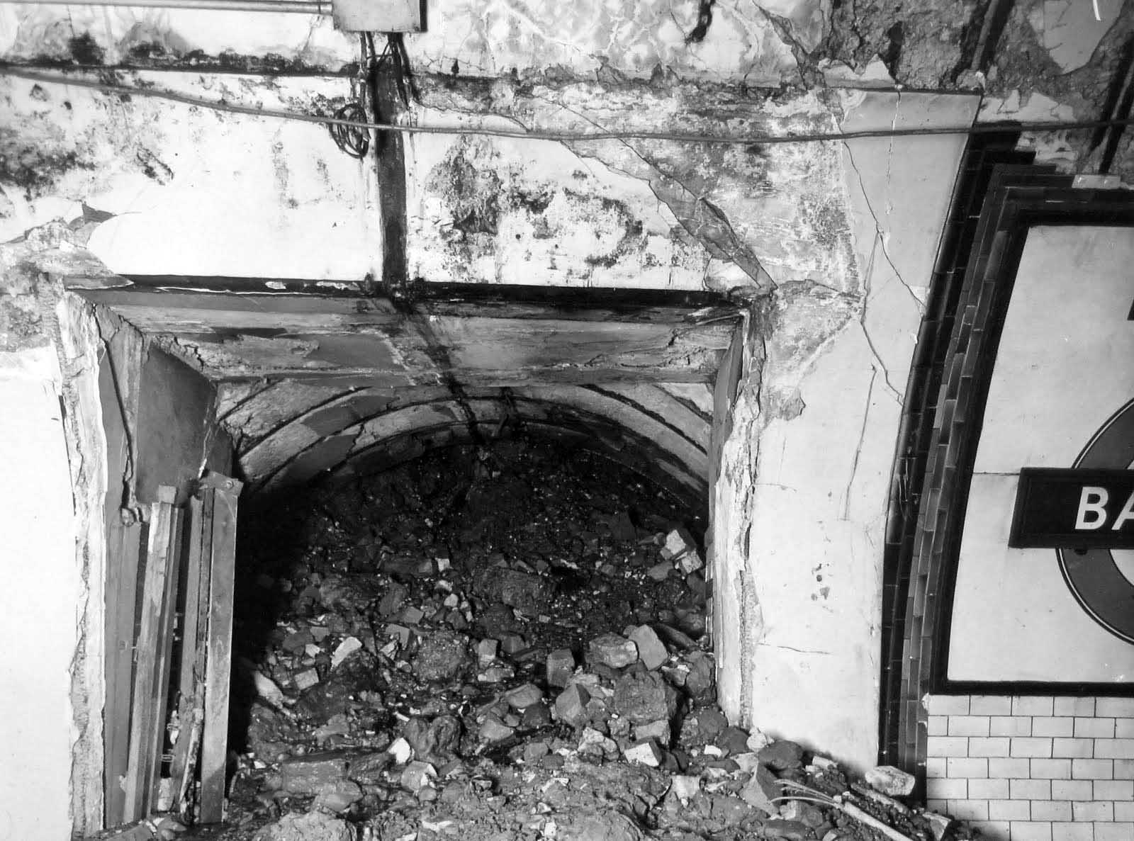 This view shows a cross-passage at the station, almost filled with rubble.
