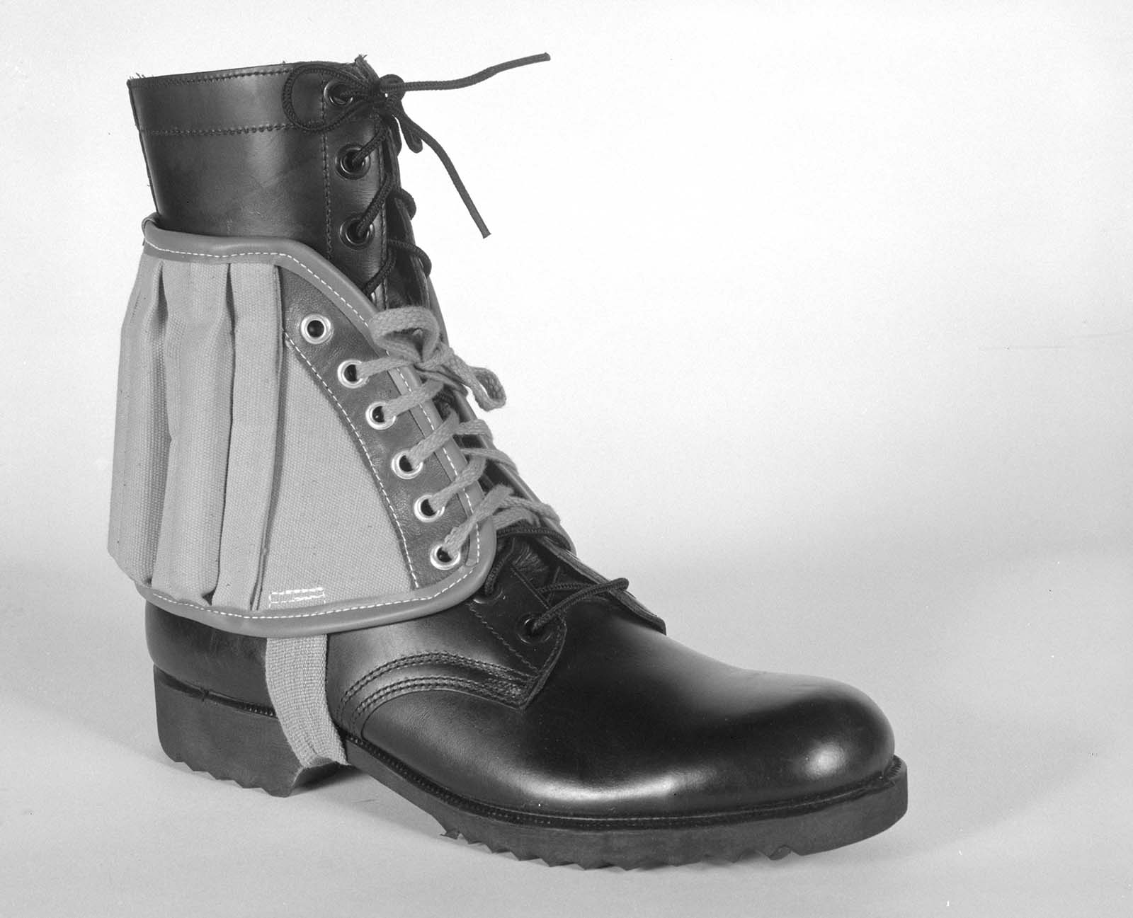 Weight spat on combat boot. 1977.
