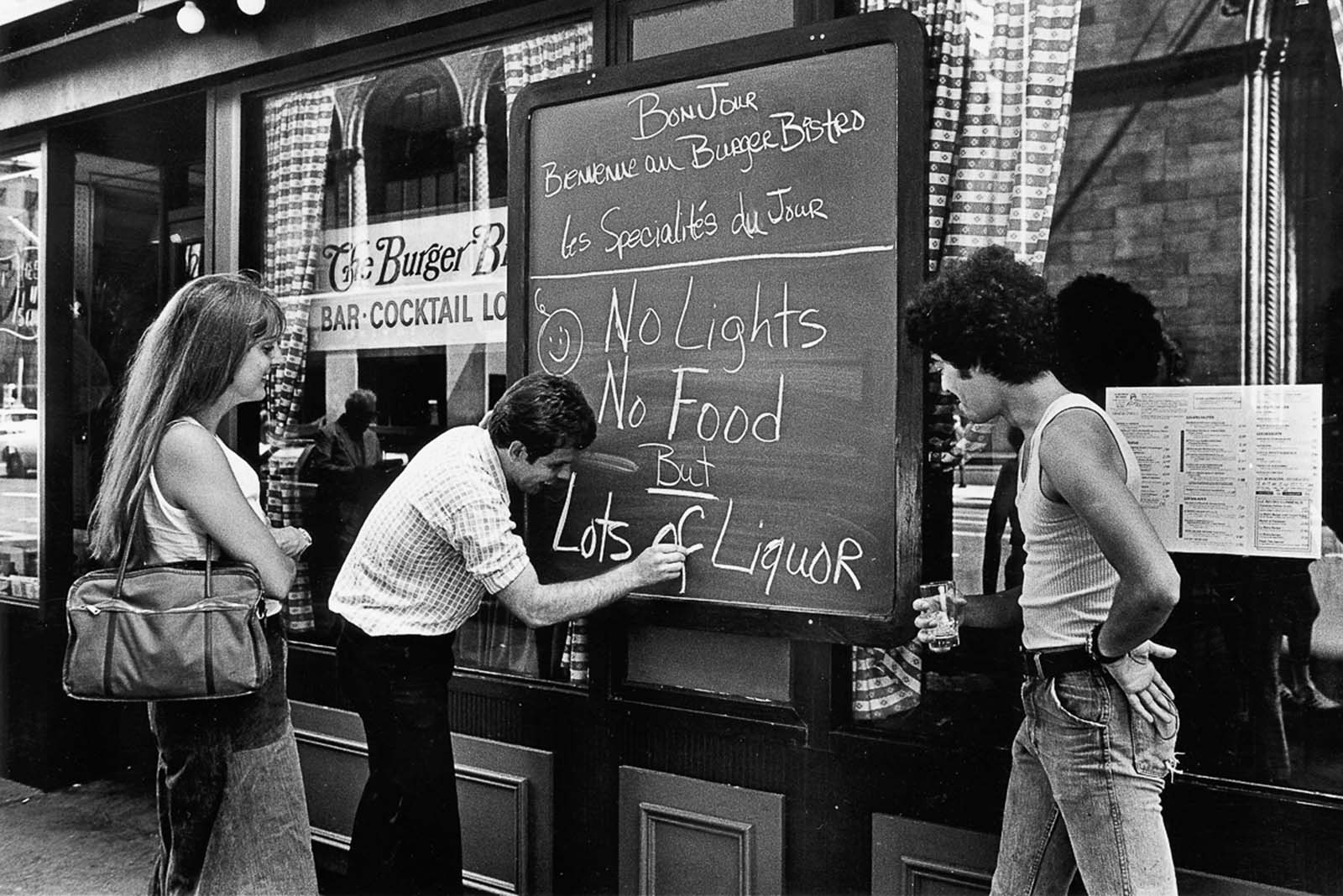 A restaurant owner updates the specials of the day during the blackout.