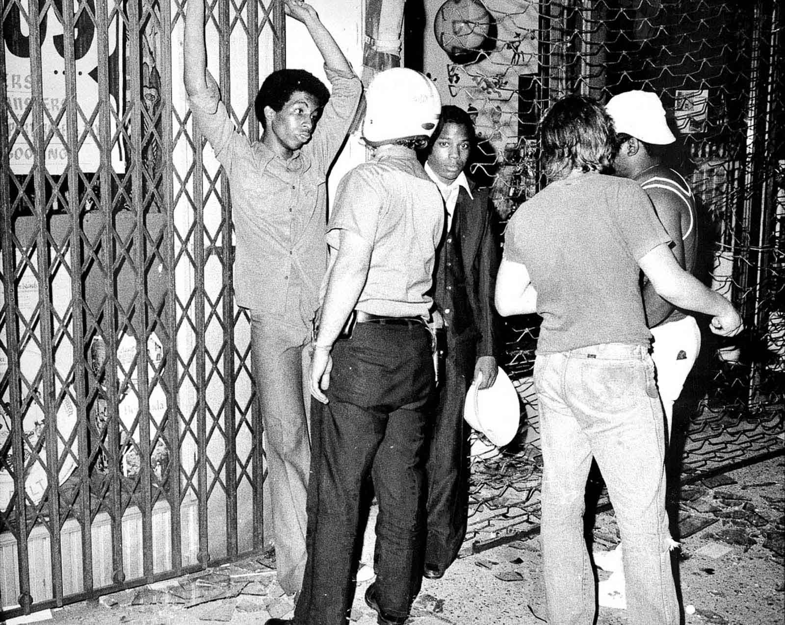 Police detain suspected looters in the Bronx.