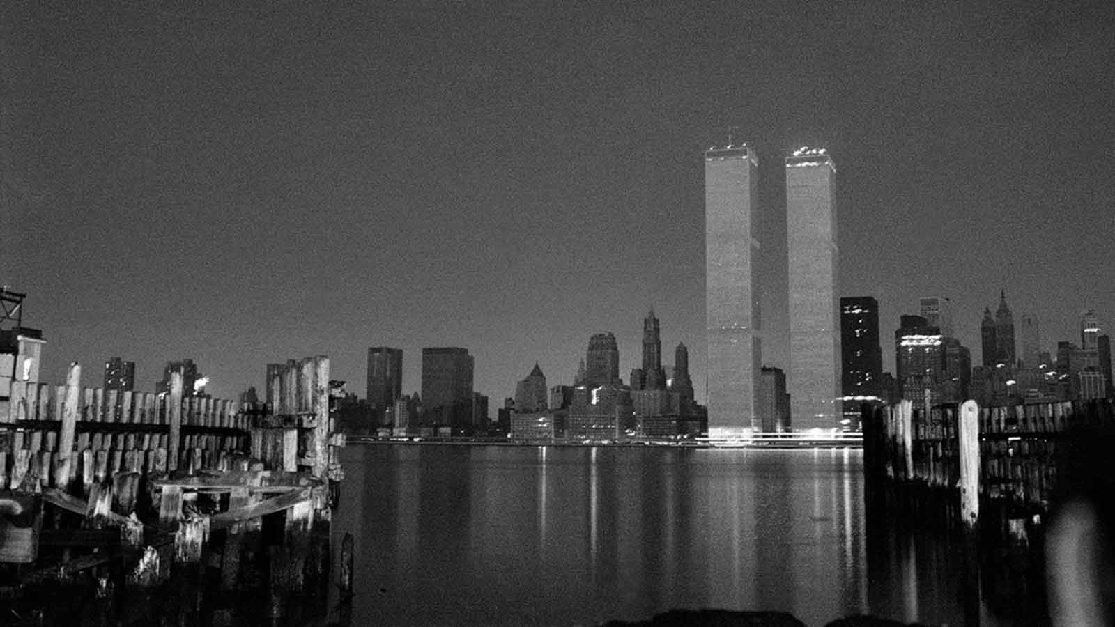 Seen from across the river in New Jersey, only the base of the World Trade Center's twin towers flickered with light.