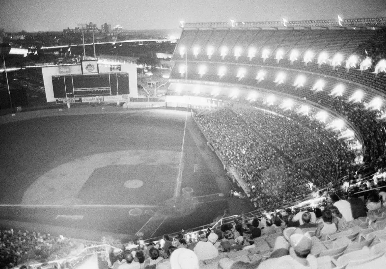 New York's Shea Stadium lies in darkness during the bottom of the sixth inning after the lights went out during the game with the Chicago Cubs, July 13, 1977.