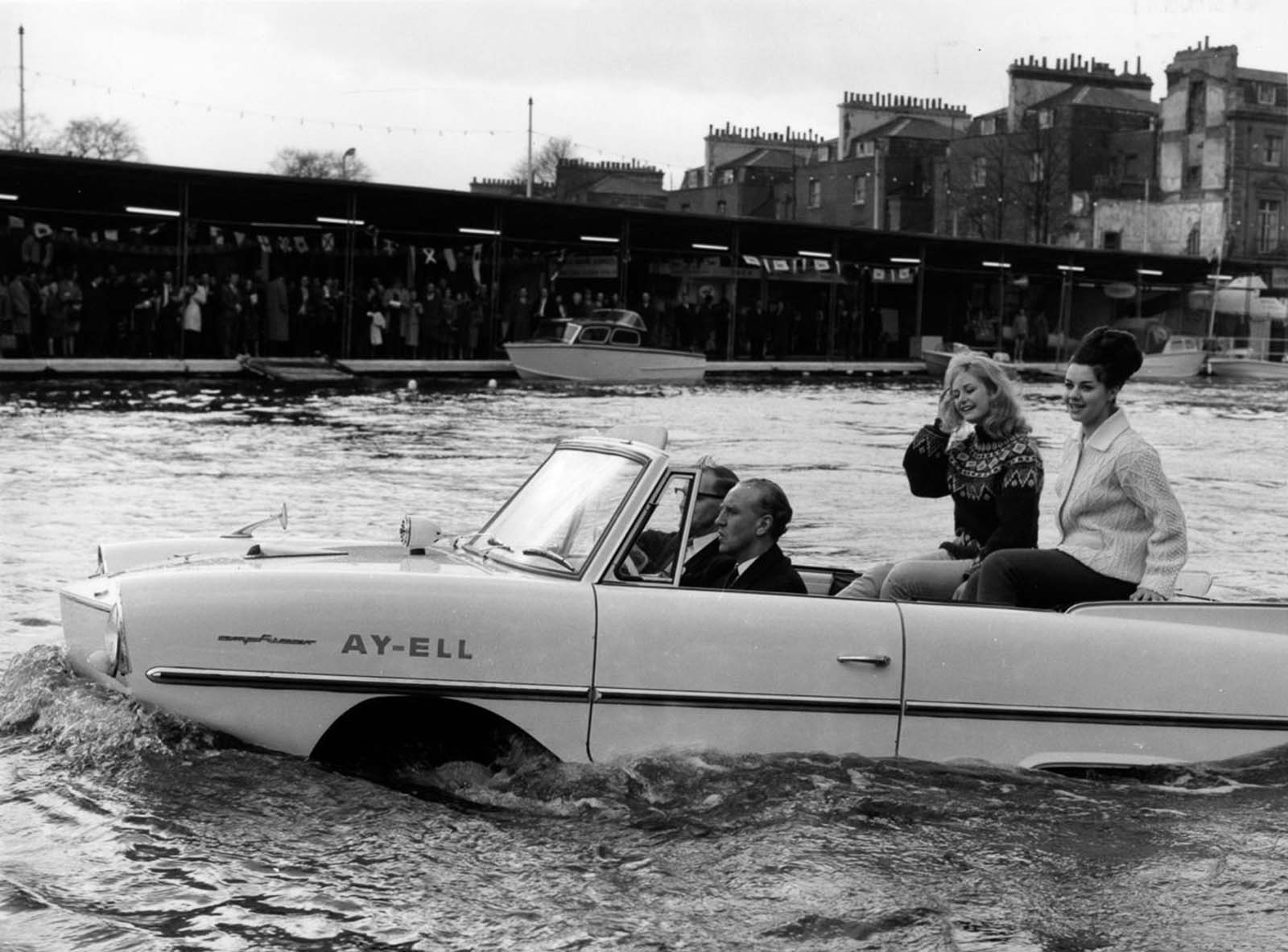 British Transport Minister Ernest Marples takes a ride in the Amphicar in London. 1964.