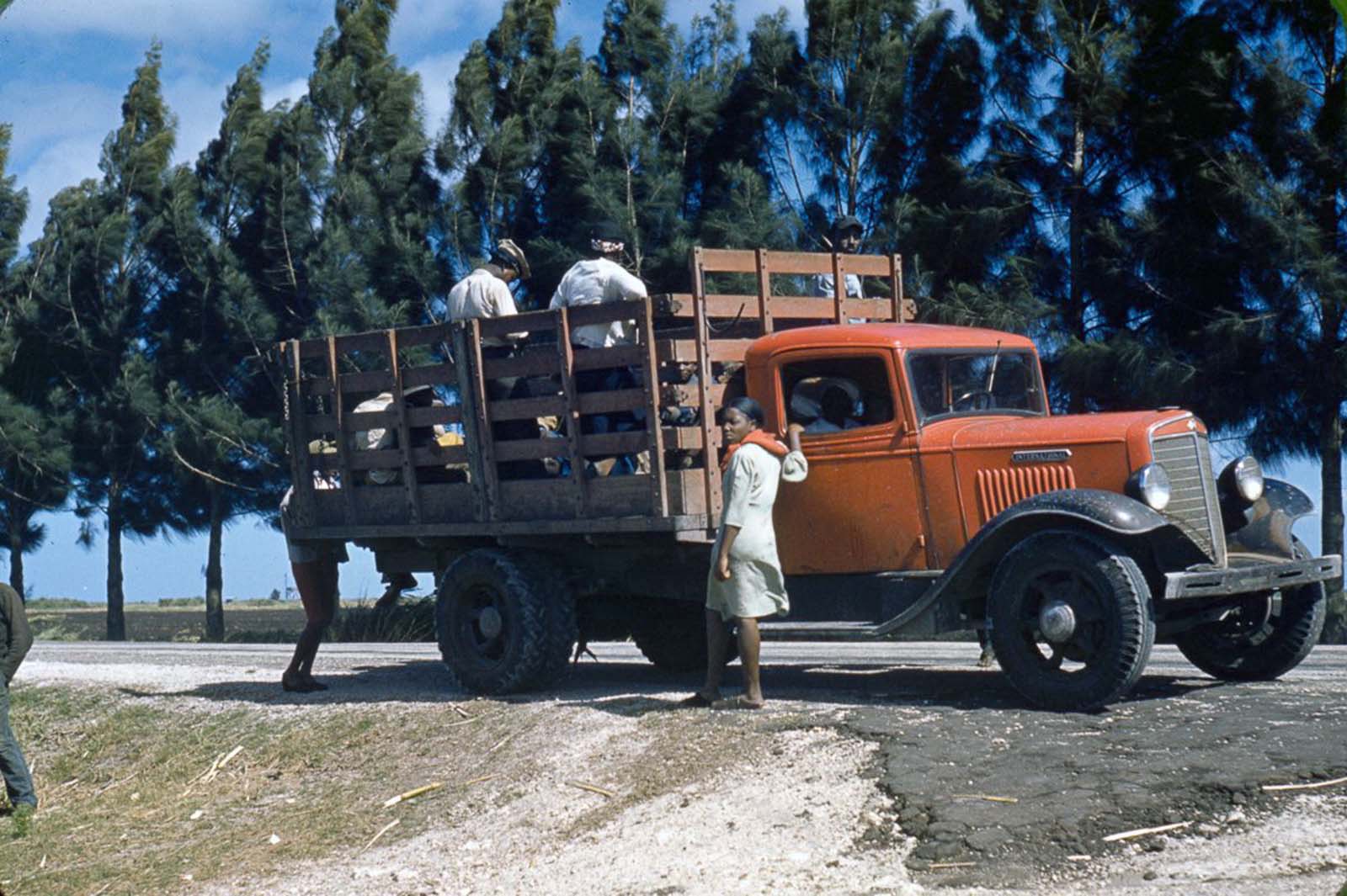 Workers board a truck in Mississippi. 1940.