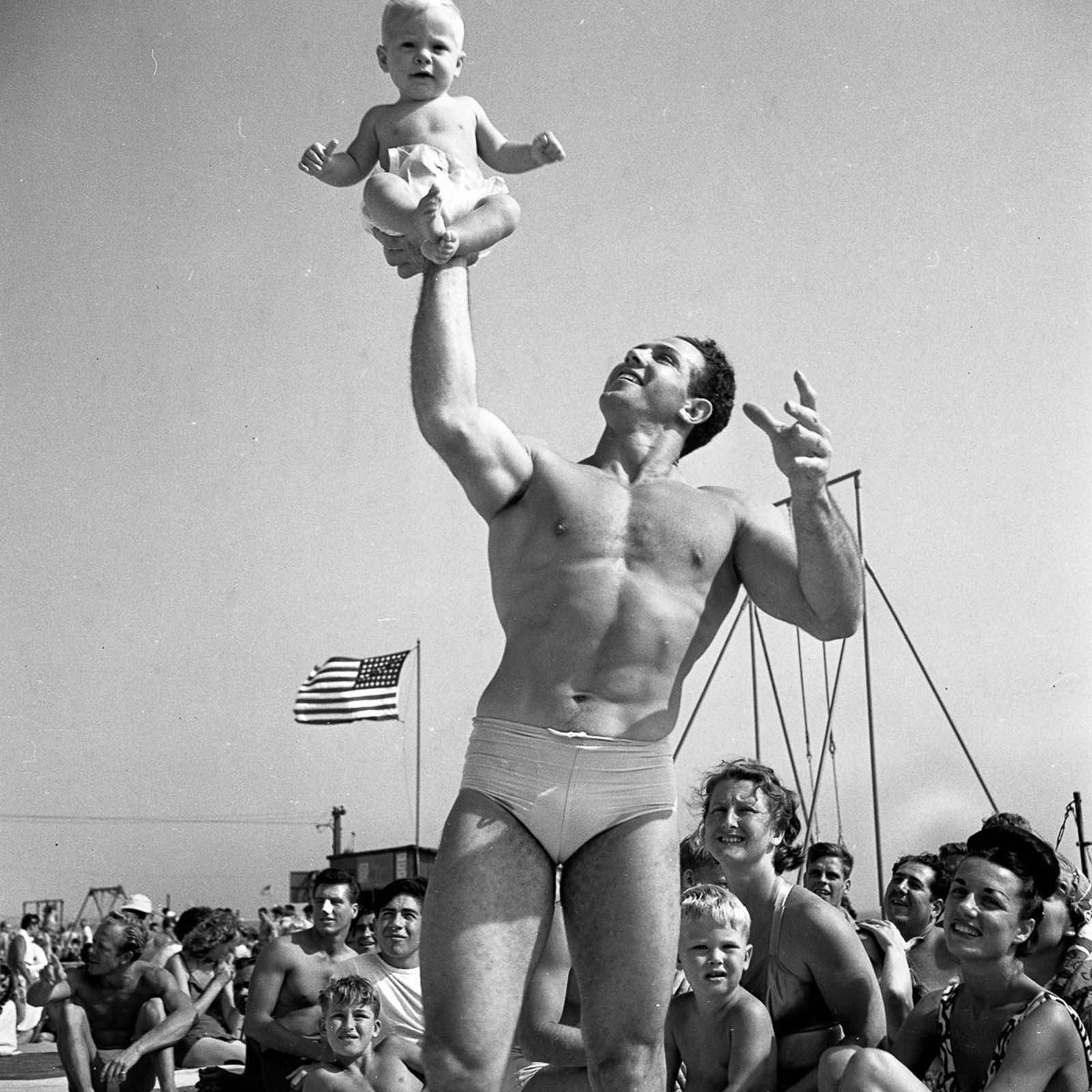 An acrobat and his son.