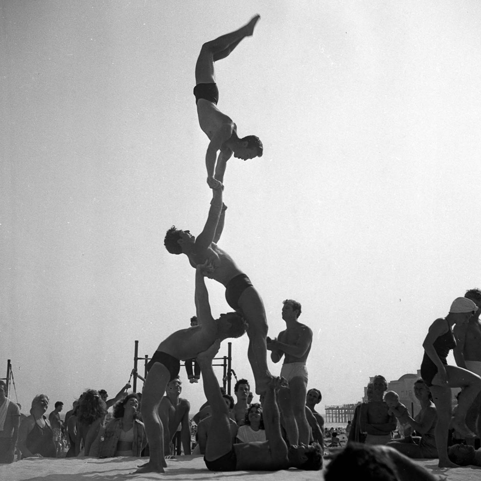 Male and female gymnasts regularly put on public shows, dazzling beachgoers with their displays of strength and balance.
