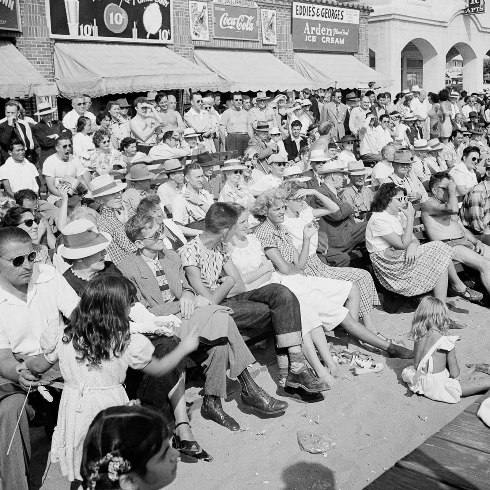 Spectators watching the performing acrobats.