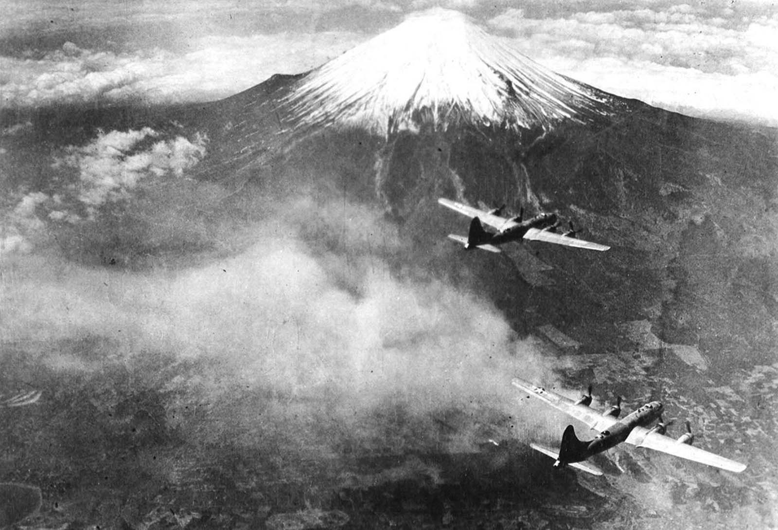 A formation of Boeing B-29 Superfortresses of the 73rd Bomb Wing fly over Mt. Fuji, Japan in 1945.