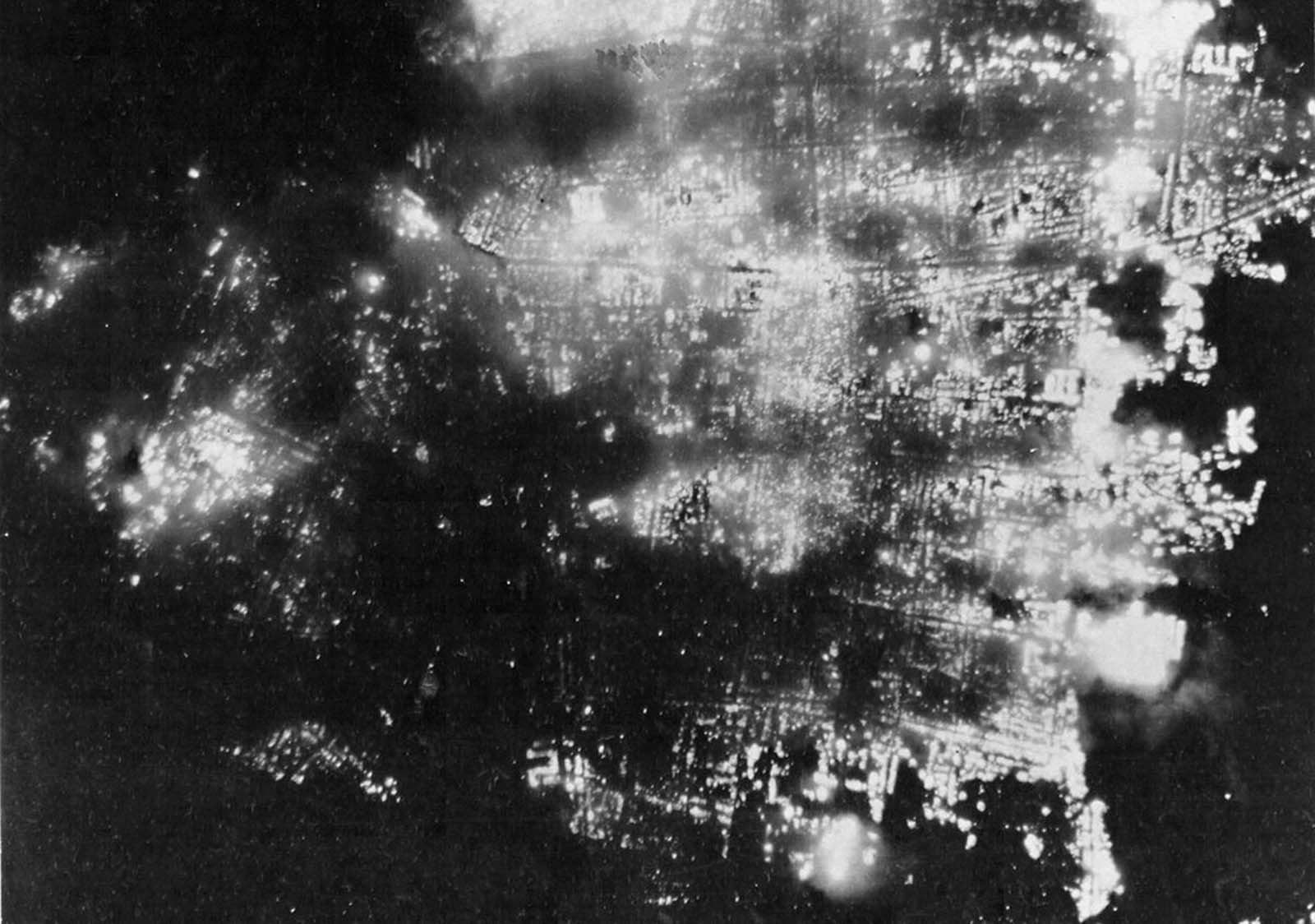 A night view of burning Toyama, Japan on August 1, 1945, after 173 American B-29 bombers dropped incendiary bombs on the city. Formerly a big producer of aluminum, the city was 95.6% demolished.