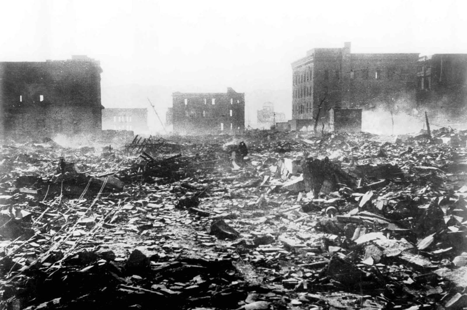 A pall of smoke lingers over this scene of destruction in Hiroshima, Japan, on August 7, 1945, a day after the explosion of the atomic bomb. Nearly 80,000 people are believed to have been killed immediately, with possibly another 60,000 survivors dying of injuries and radiation exposure by 1950.