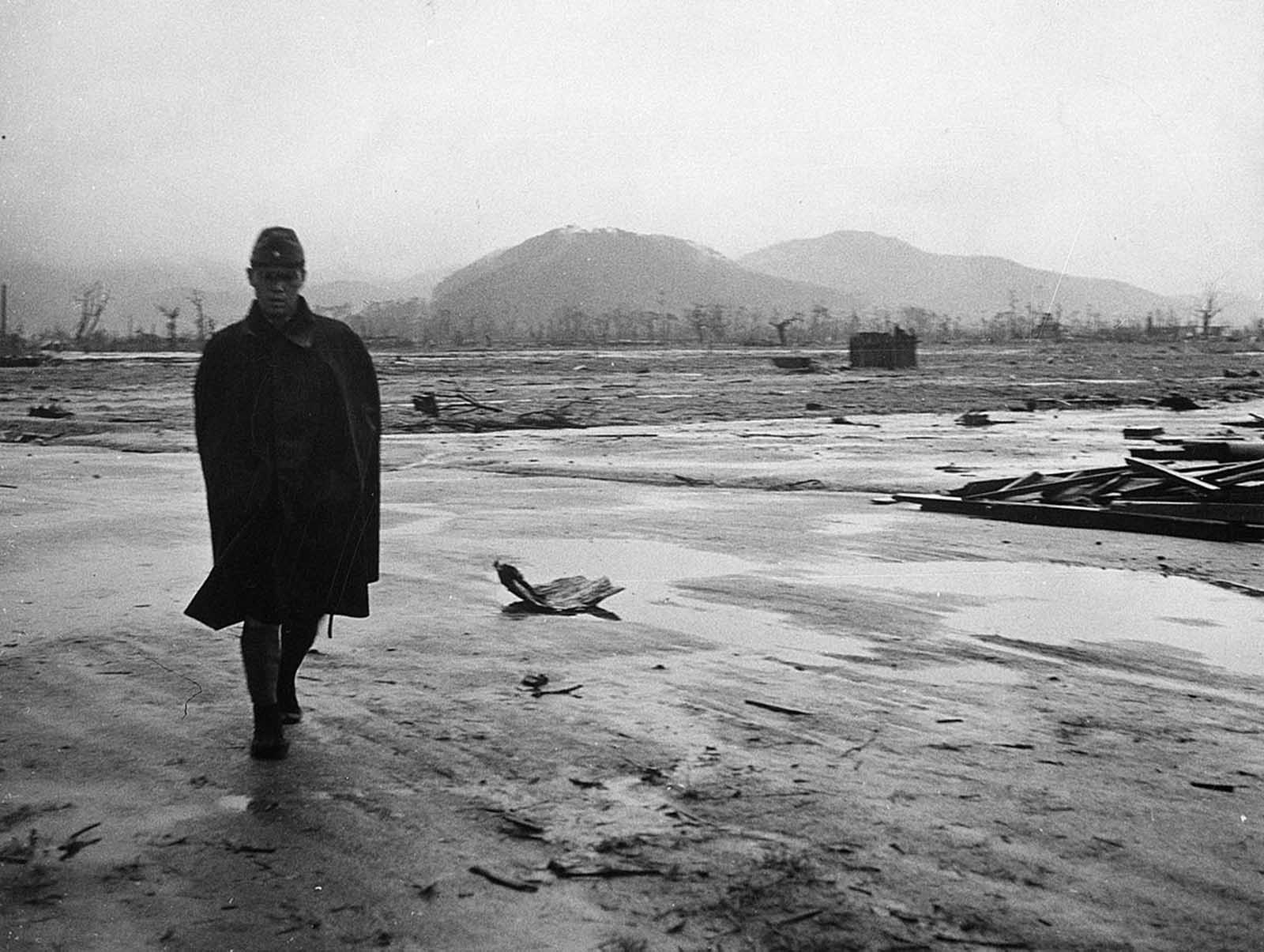A Japanese soldier walks through a completely leveled area of Hiroshima in September of 1945.