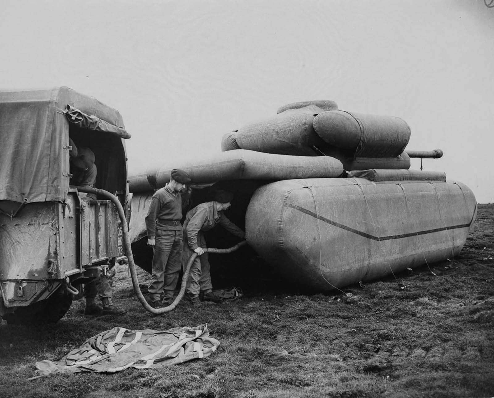 British troops inflate a rubber dummy tank. 1940.