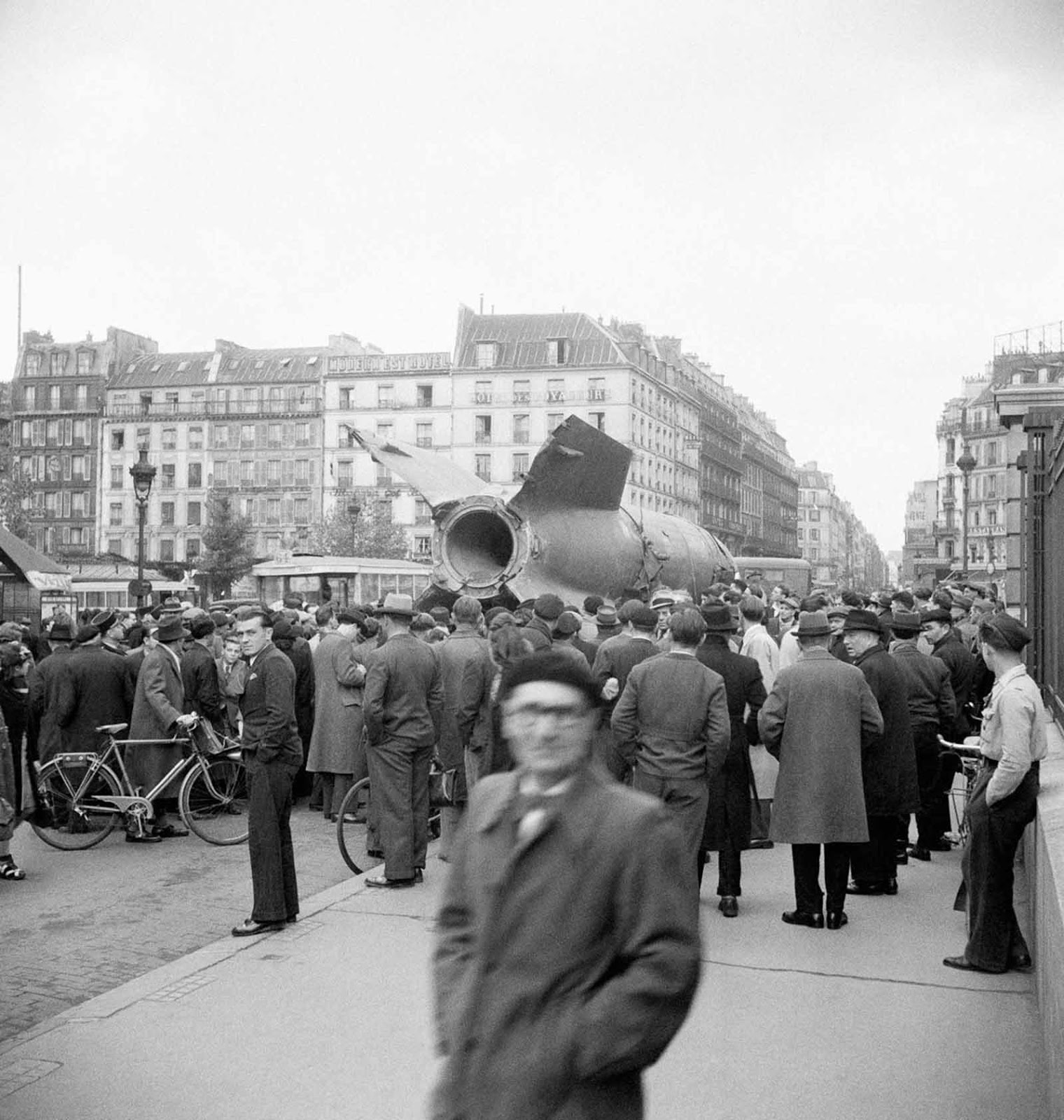 A captured V-2 is paraded through Paris. 1945.