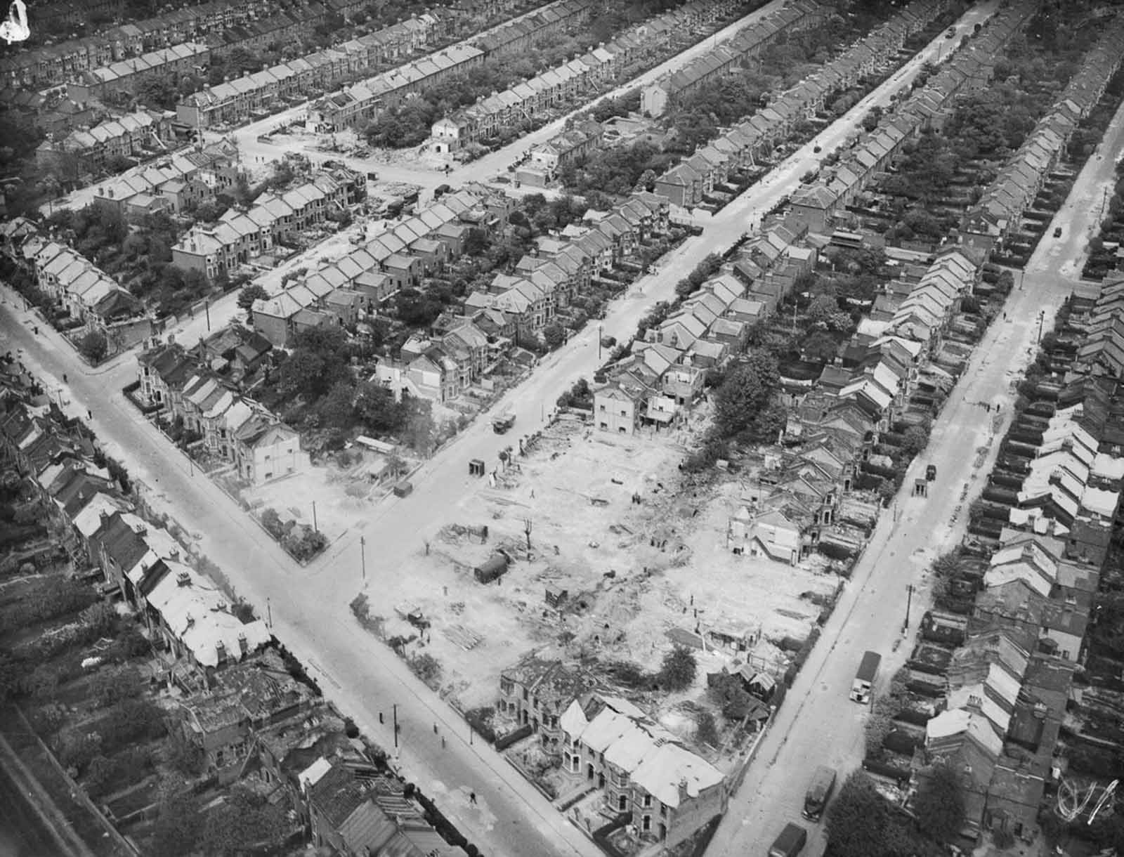 Houses are being cleared away in Essex after a V-2 explosion damaged and destroyed dozens of houses and killed nine people. 1945.