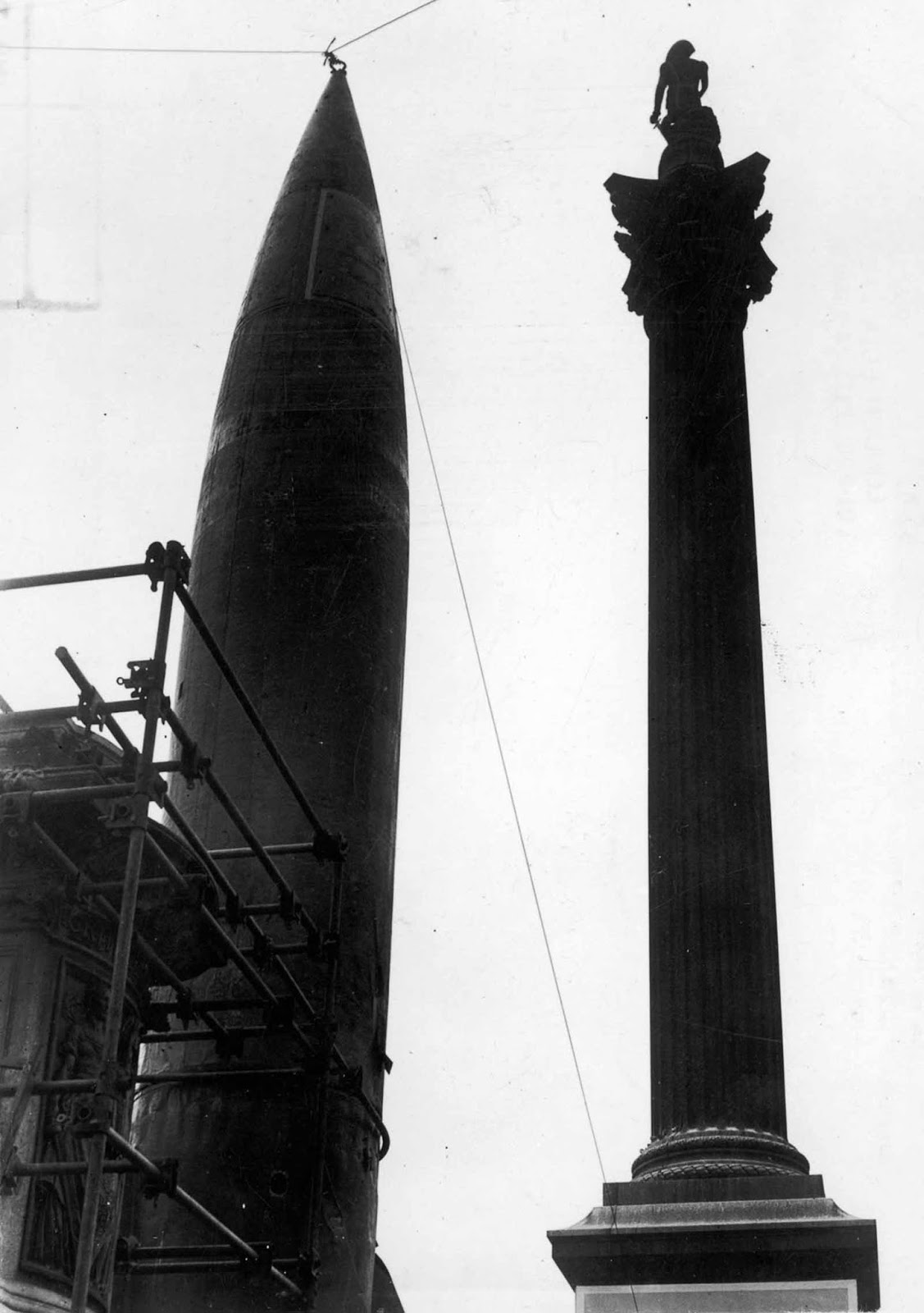 A V-2 rocket stands on display alongside Nelson's Column in Trafalgar Square. 1945.