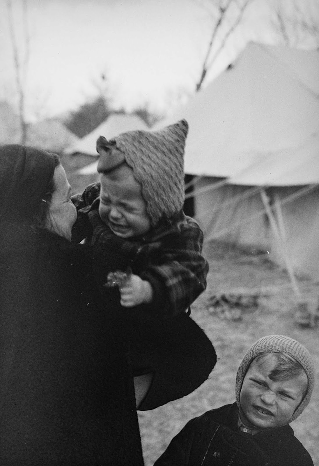 A Polish woman holds her baby girl at an evacuee camp in Tehran.