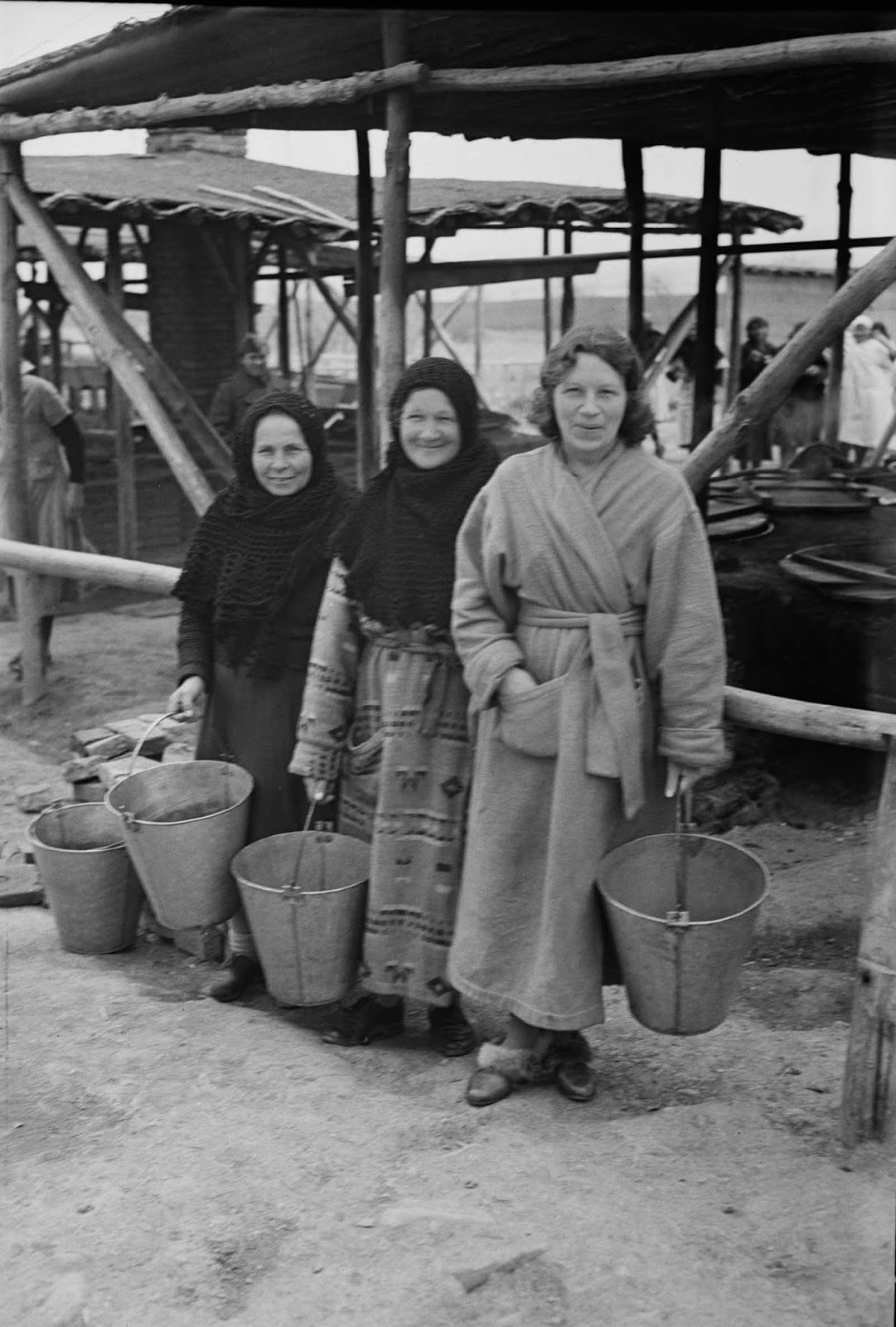 Evacuees wear donated woolen bathrobes as overcoats.