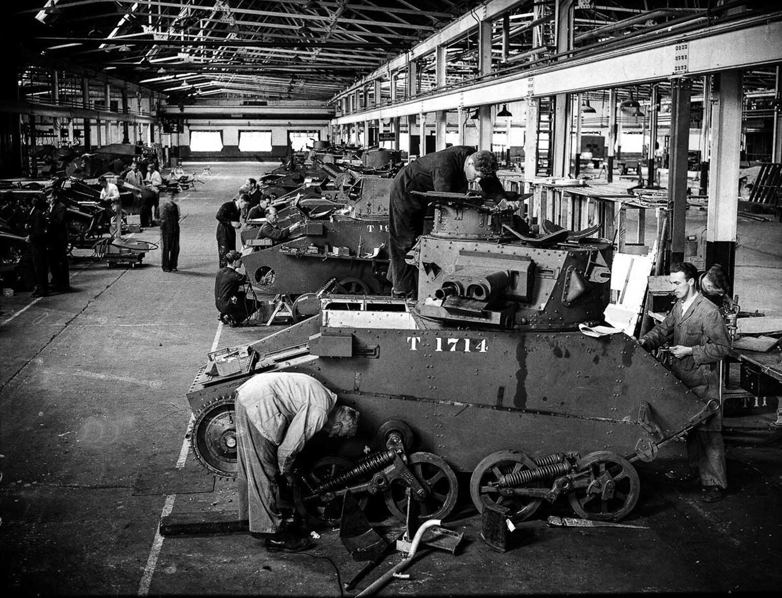 British tanks on an assembly line. Some of the tanks are being repaired following the evacuation of Dunkirk. 1940.