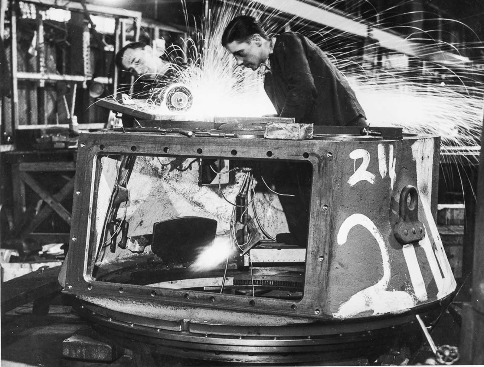Workers in a Ministry of Supply factory making a turret for a 