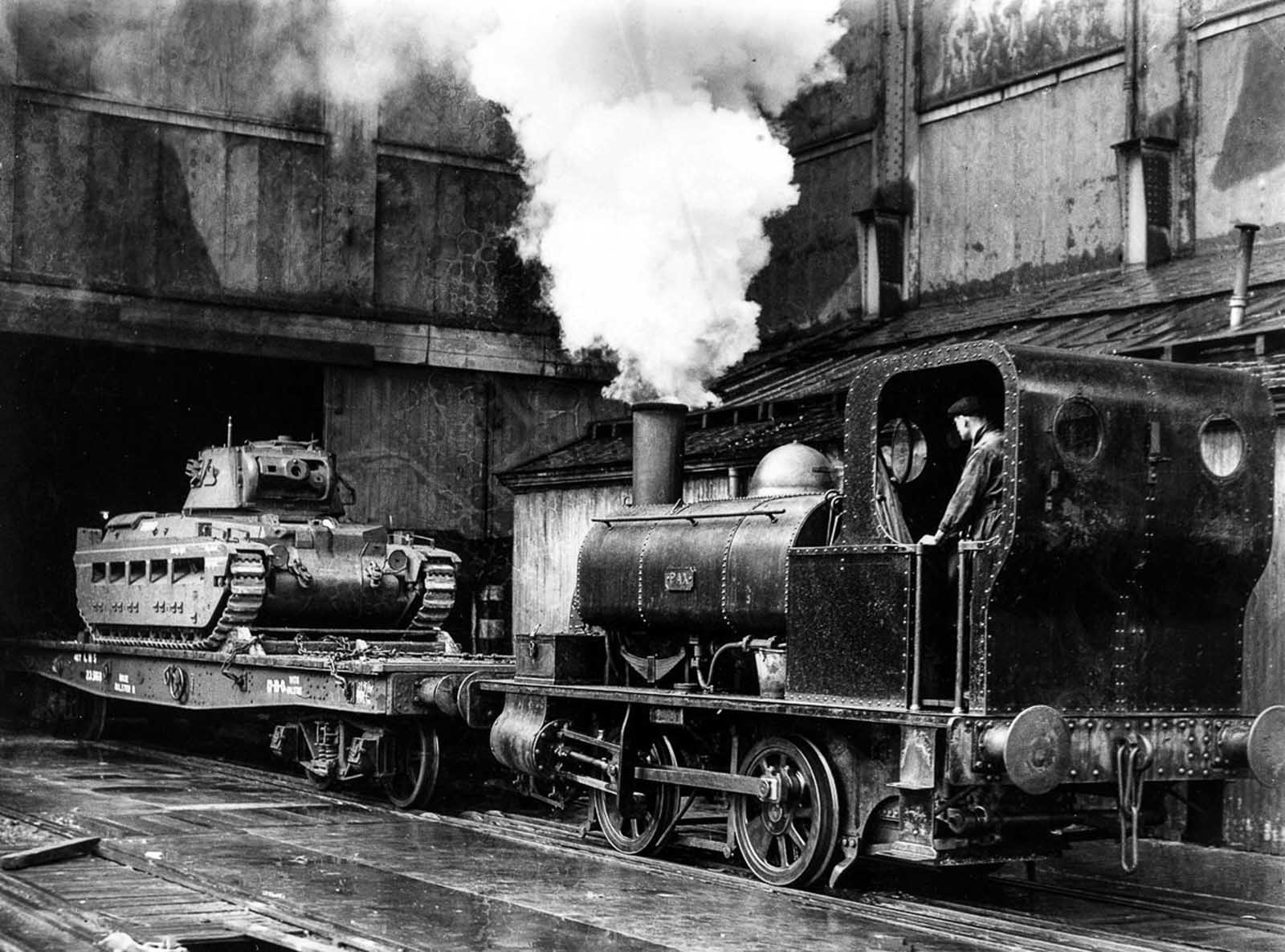 A British tank is pulled by a train from a Midlands factory bound for the Eastern Front to aid the Soviet Union. 1941.