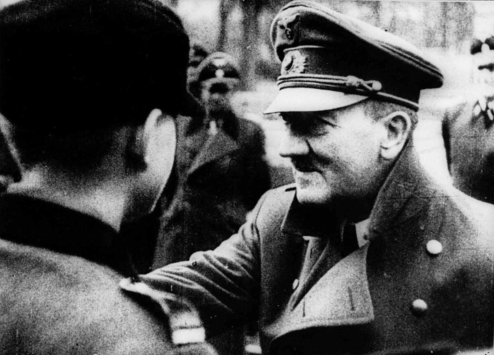 Adolf Hitler decorates members of his Nazi youth organization 