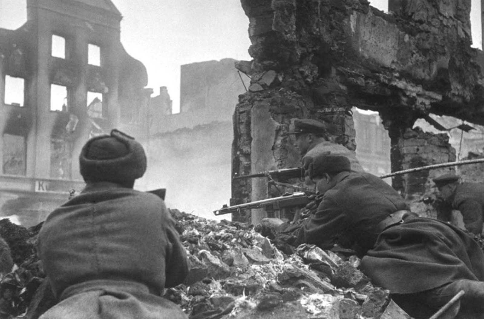 Soviet soldiers lead house-to-house fighting in the outskirts of Königsberg, East Prussia, Germany, in April of 1945.