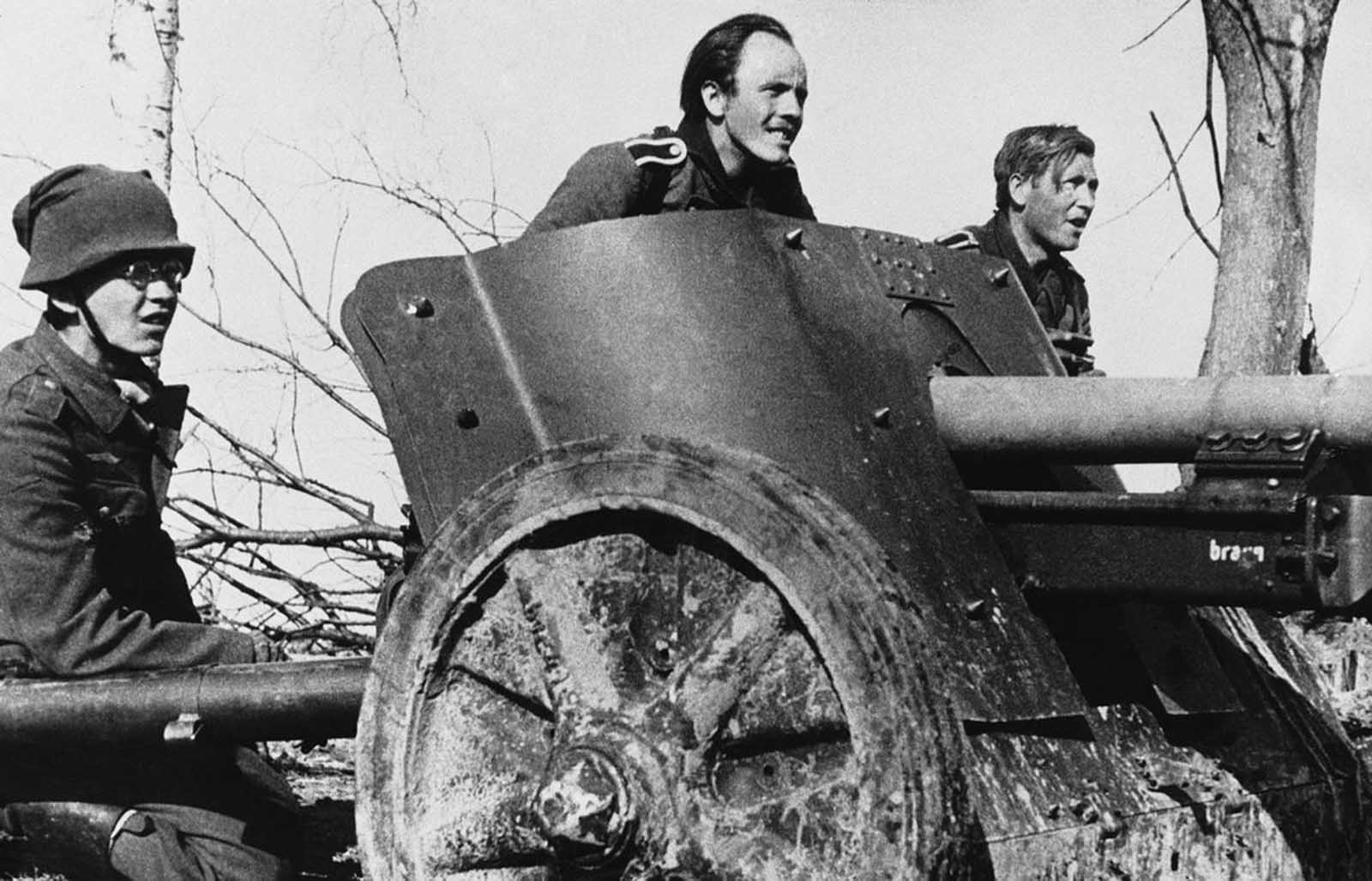 The crew of a German anti-tank gun, ready for action at the Russian front in late 1942.