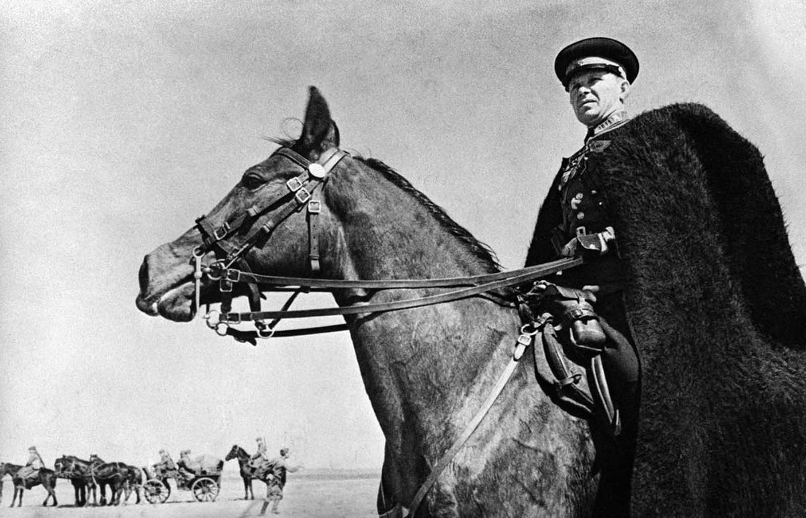The commander of a Cossack unit on active service in the Kharkov region, Ukraine, on June 21, 1942, watching the progress of his troops. 