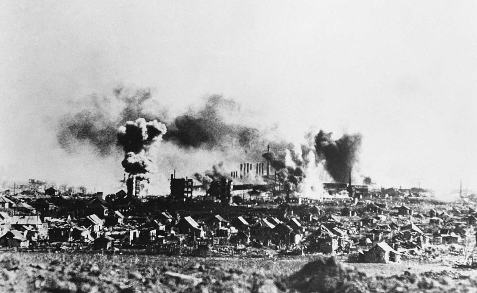 While Russian forces drive around behind them, threatening encirclement, the Germans continue their attempt to take Stalingrad. A Stuka raid on the factory district of Stalingrad is seen in this photo, taken on November 24, 1942. 