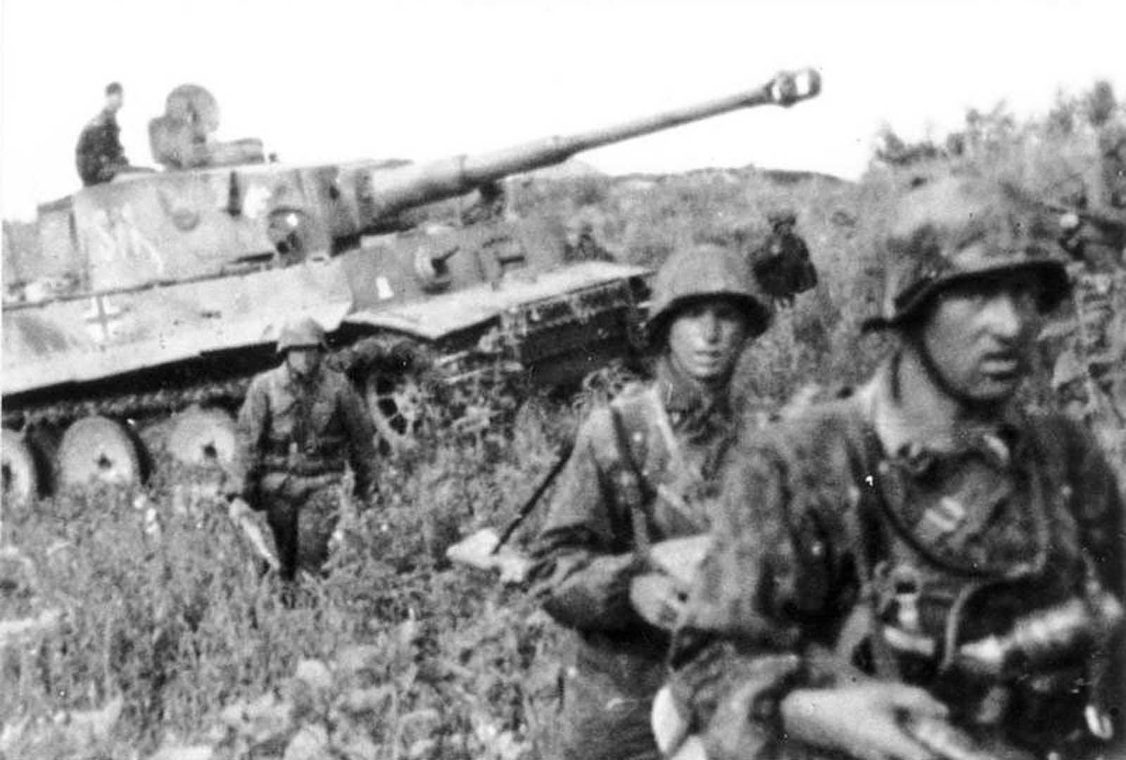 German soldiers march before a 