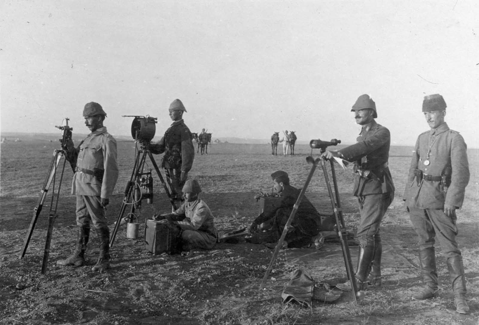 Turkish troops use a heliograph at Huj, near aza City, in 1917. A heliograph is a wireless solar telegraph that signals by flashes of sunlight usually using Morse code, reflected by a mirror.