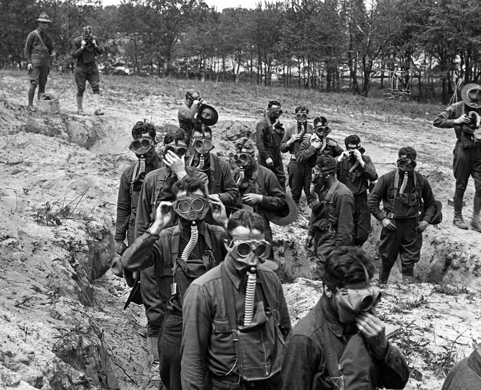 U.S. Soldiers in training, about to enter a tear gas trench at Camp Dix, New Jersey, ca. 1918.