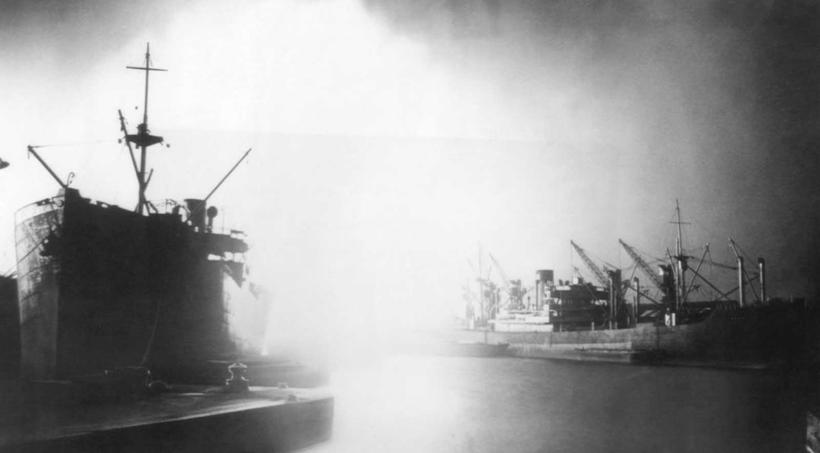 Fires set by bursting German bombs lit up the docks along the River Thames in London, on September 7, 1940 and brought into vivid relief the merchant ships lying alongside the many docks which line London's busy port. British sources said the bombing that night was the heaviest of the war to date.