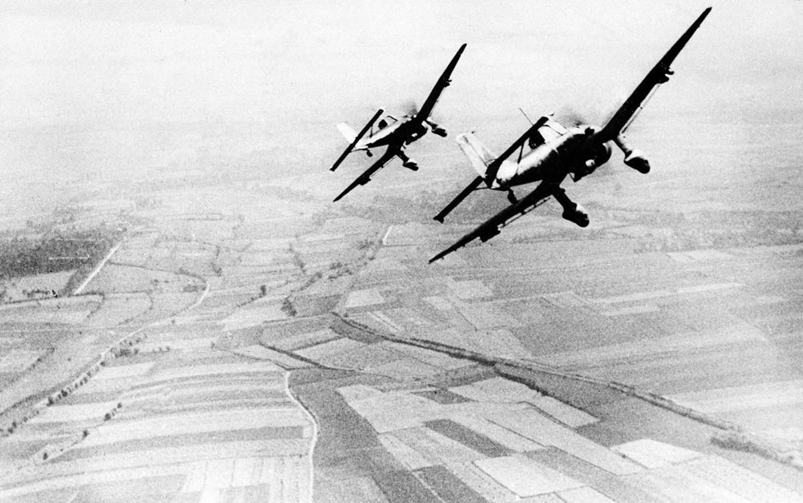 Two German Luftwaffe Ju 87 Stuka dive bombers return from an attack against the British south coast, during the Battle for Britain, on August 19, 1940.