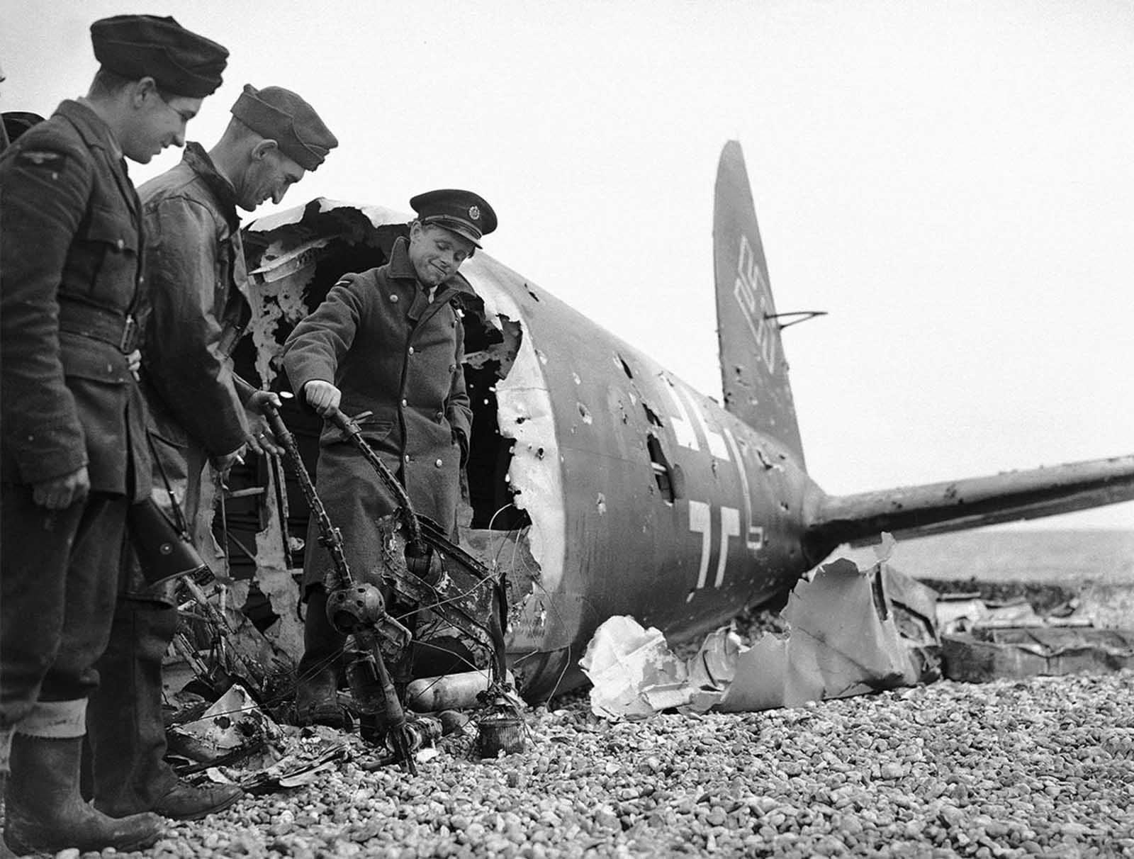 All that remains of a German bomber brought down on the English south-east coast, on July 13, 1940. The aircraft is riddled with bullet holes and its machine guns were twisted out of action.