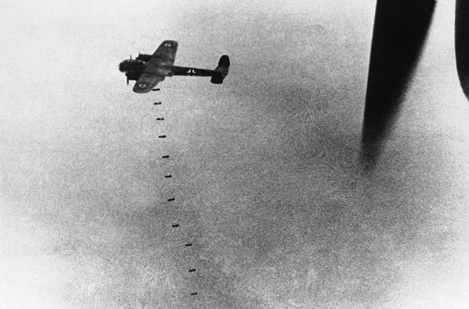 A German aircraft drops its load of bombs above England, during an attack on September 20, 1940.