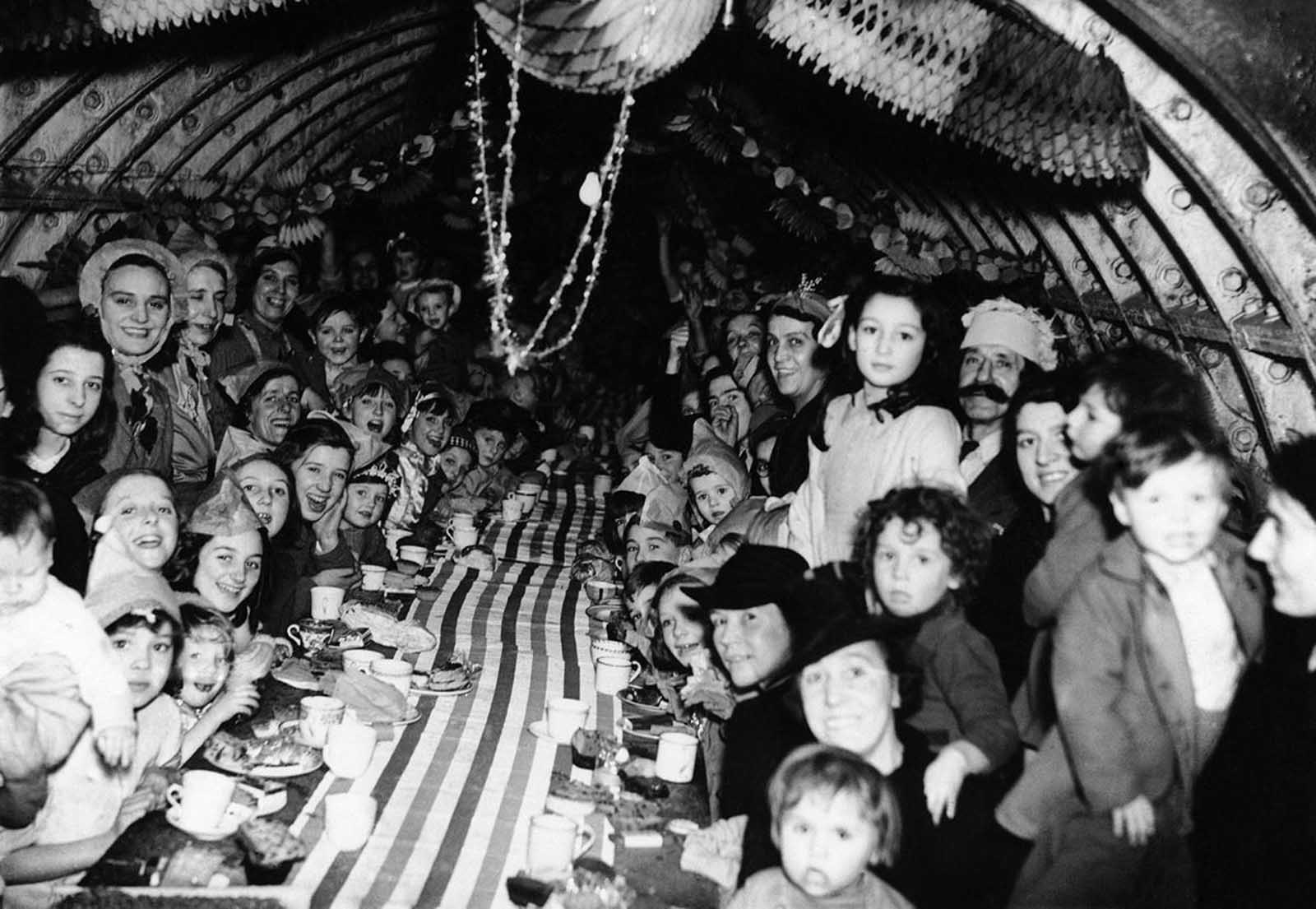 London children enjoy themselves at a Christmas Party, on December 25, 1940, in an underground shelter.